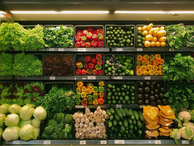 Fresh produce in a refrigerated supermarket display kept cool by commercial refrigeration